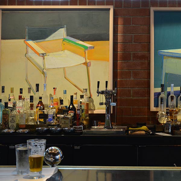 Raimond Staprans paintings behind the bar in Santa Monica